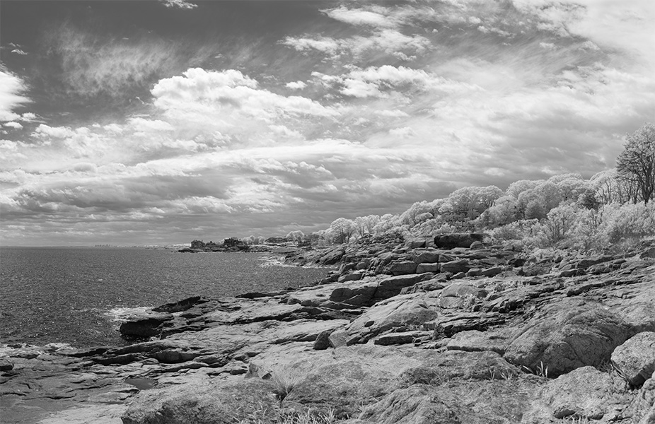Panoramic Infrared Photograph of Rocky New England Coastline and Sea and Clouds.